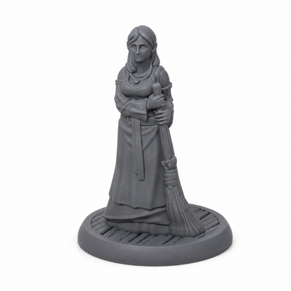 3D-printet tjenestekvinne med kost, lang kjole og rolig positur i grå PLA til D&D og tabletop-rollespill.
